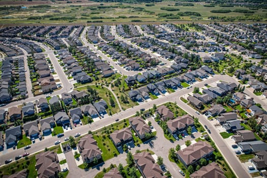 Captivating aerial shot of Stonebridge in Saskatoon, highlighting the harmonious blend of modern architecture and Saskatchewan's verdant surroundings.