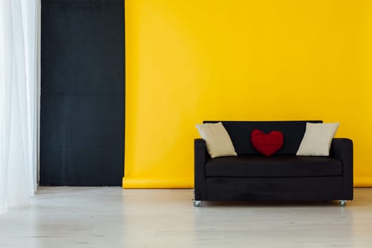 sofa in the interior of the room with a yellow background
