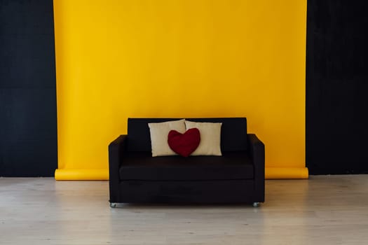 sofa in the interior of the room with a yellow background