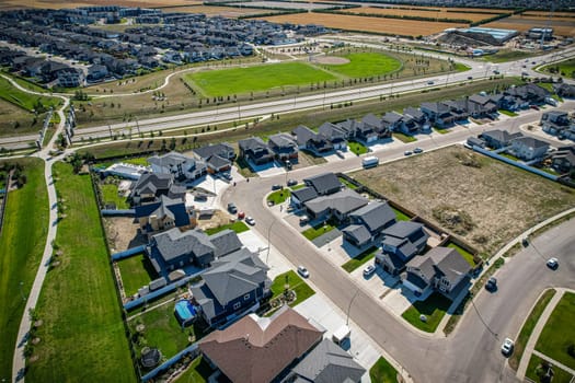 Stunning bird's-eye perspective of the Evergreen neighborhood in Saskatoon, showcasing the unique urban layout and the natural beauty of Saskatchewan's landscapes.
