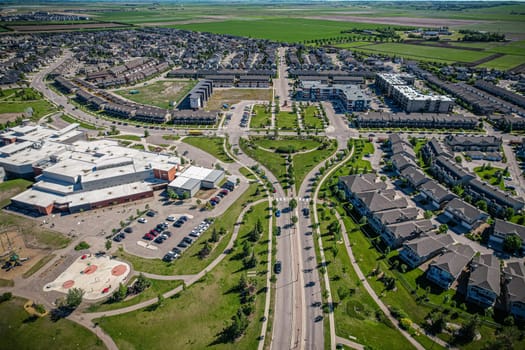 Elevated panorama of Willowgrove, showcasing the neighborhood's modern aesthetics intertwined with pockets of lush green, epitomizing Saskatoon's suburban beauty