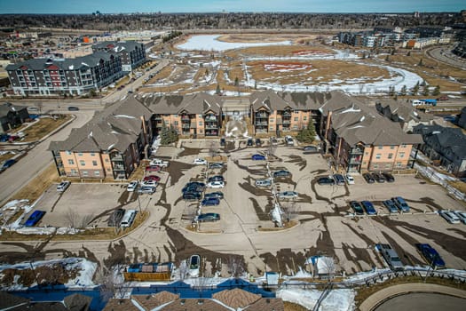 Captivating aerial shot of Stonebridge in Saskatoon, highlighting the harmonious blend of modern architecture and Saskatchewan's verdant surroundings.