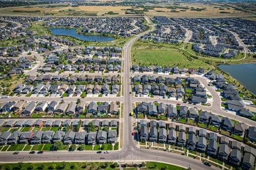 Captivating aerial shot of Stonebridge in Saskatoon, highlighting the harmonious blend of modern architecture and Saskatchewan's verdant surroundings.