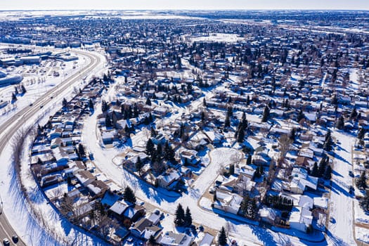 Explore the lush Forest Grove neighborhood in Saskatoon from an aerial perspective. This drone image captures the area's verdant charm, peaceful streets, and community warmth, under the vast Saskatchewan sky.