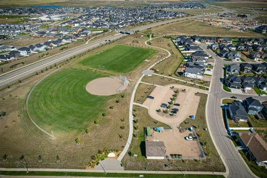 Stunning bird's-eye perspective of the Evergreen neighborhood in Saskatoon, showcasing the unique urban layout and the natural beauty of Saskatchewan's landscapes.