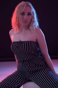 Beautiful blonde woman in striped clothes