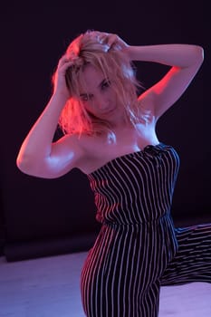 Beautiful blonde woman in striped clothes