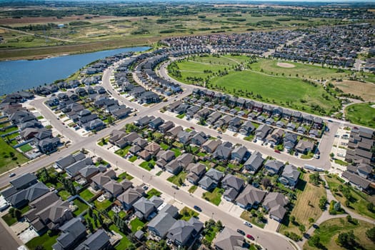 Captivating aerial shot of Stonebridge in Saskatoon, highlighting the harmonious blend of modern architecture and Saskatchewan's verdant surroundings.