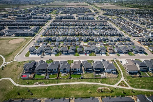 Stunning bird's-eye perspective of the Evergreen neighborhood in Saskatoon, showcasing the unique urban layout and the natural beauty of Saskatchewan's landscapes.