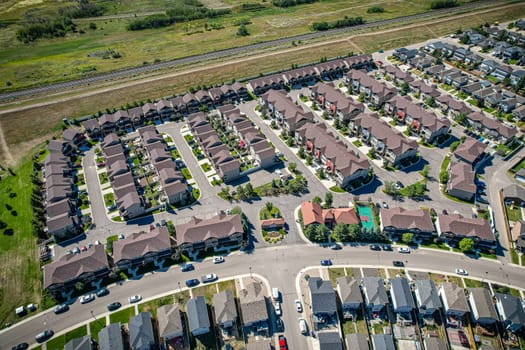 Captivating aerial shot of Stonebridge in Saskatoon, highlighting the harmonious blend of modern architecture and Saskatchewan's verdant surroundings.