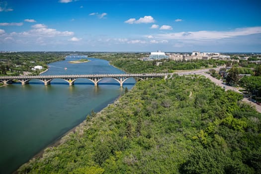 Aerial spectacle of downtown Saskatoon, revealing the city's architectural marvels, bustling streets, and the pulsating core of Saskatchewan's metropolis