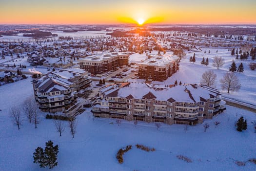 Fly over The Willows in Saskatoon, where the allure of upscale living meets the tranquility of golf course greens. This image captures the well-manicured landscapes and exclusive residences.