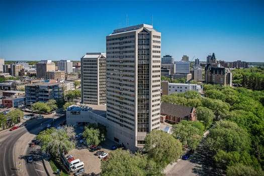 Aerial spectacle of downtown Saskatoon, revealing the city's architectural marvels, bustling streets, and the pulsating core of Saskatchewan's metropolis