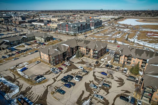 Captivating aerial shot of Stonebridge in Saskatoon, highlighting the harmonious blend of modern architecture and Saskatchewan's verdant surroundings.