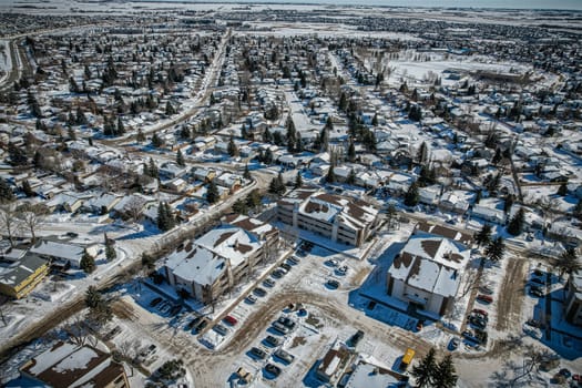 Soaring over Lakeview in Saskatoon, this bird's-eye capture magnifies the neighborhood's tranquil waters, verdant parks, and the serene rhythm of Saskatchewan living
