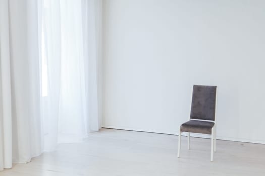 grey vintage chair in the interior of an empty room
