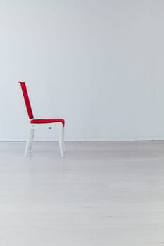 red vintage chair in the interior of an empty room