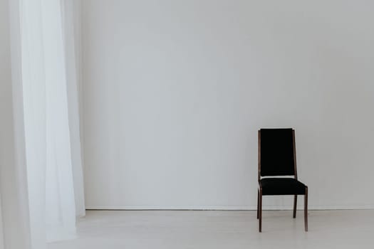 black vintage chair in the interior of an empty room