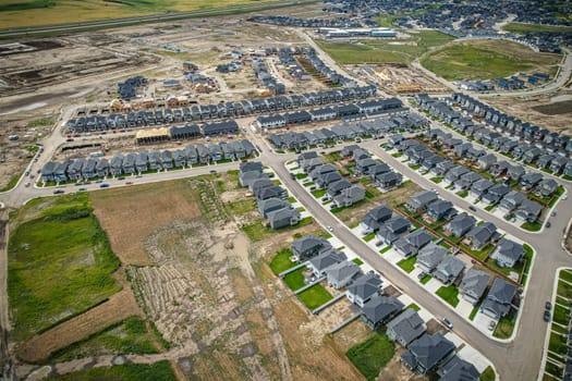 Elevated view of Rosewood neighborhood in Saskatoon, presenting a tapestry of urban design intertwined with Saskatchewan's serene natural canvas.