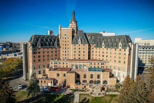 Aerial spectacle of downtown Saskatoon, revealing the city's architectural marvels, bustling streets, and the pulsating core of Saskatchewan's metropolis