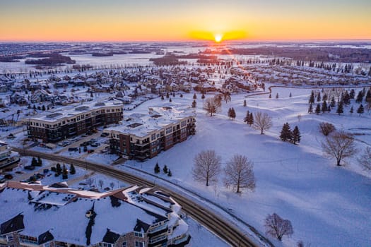 Fly over The Willows in Saskatoon, where the allure of upscale living meets the tranquility of golf course greens. This image captures the well-manicured landscapes and exclusive residences.