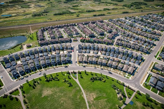 Captivating aerial shot of Stonebridge in Saskatoon, highlighting the harmonious blend of modern architecture and Saskatchewan's verdant surroundings.