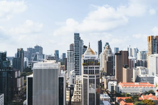 Closeup image of Bangkok cityscape. Modern cityscape surrounded with architectural building with day light and blue sky. Side view. Business background. Day light. Ornamented.