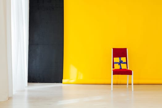 red chair in the interior with a yellow background
