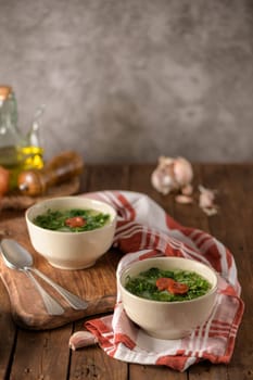 Caldo verde popular soup in Portuguese cuisine. traditional ingredients for caldo verde are potatoes, collard greens , olive oil and salt. Additionally garlic or onion may be added.