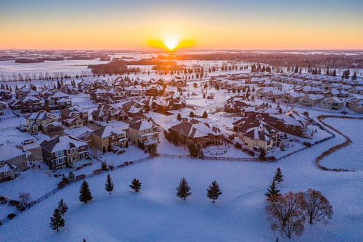 Fly over The Willows in Saskatoon, where the allure of upscale living meets the tranquility of golf course greens. This image captures the well-manicured landscapes and exclusive residences.