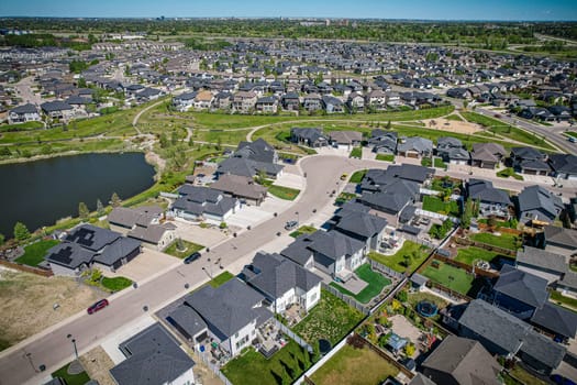 Captivating aerial shot of Stonebridge in Saskatoon, highlighting the harmonious blend of modern architecture and Saskatchewan's verdant surroundings.