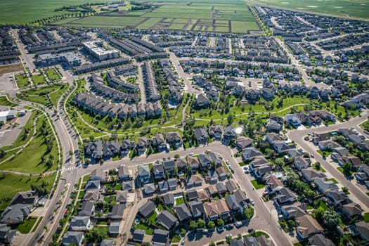 Elevated panorama of Willowgrove, showcasing the neighborhood's modern aesthetics intertwined with pockets of lush green, epitomizing Saskatoon's suburban beauty