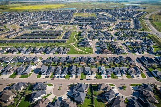 Elevated panorama of Willowgrove, showcasing the neighborhood's modern aesthetics intertwined with pockets of lush green, epitomizing Saskatoon's suburban beauty