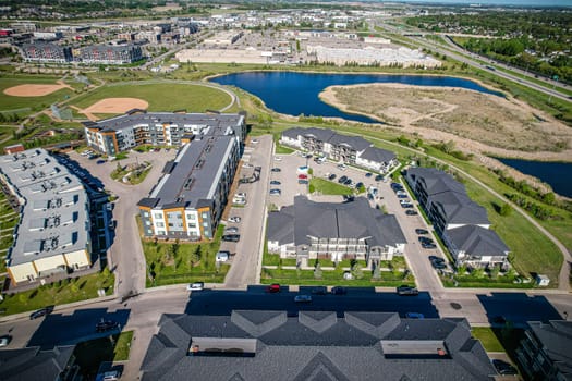 Captivating aerial shot of Stonebridge in Saskatoon, highlighting the harmonious blend of modern architecture and Saskatchewan's verdant surroundings.