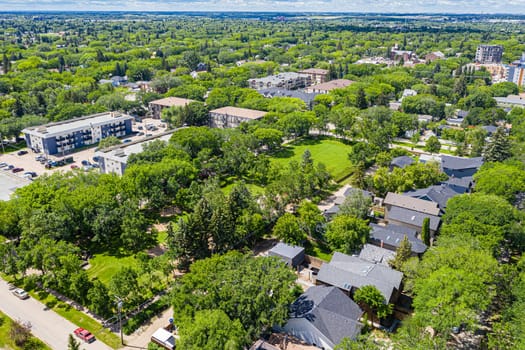 Ascend above Varsity View, the Saskatoon neighborhood celebrated for its proximity to university life. The drone image showcases a mix of residential areas, academic buildings, and lush parklands.
