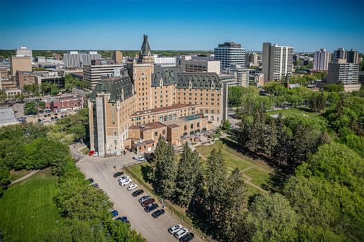 Aerial spectacle of downtown Saskatoon, revealing the city's architectural marvels, bustling streets, and the pulsating core of Saskatchewan's metropolis
