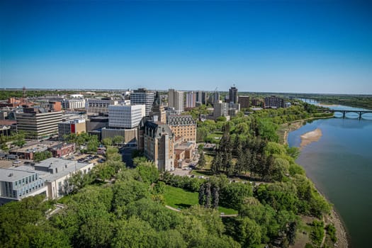 Aerial spectacle of downtown Saskatoon, revealing the city's architectural marvels, bustling streets, and the pulsating core of Saskatchewan's metropolis