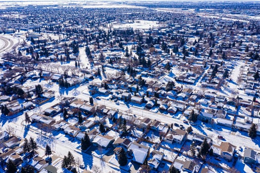 Explore the lush Forest Grove neighborhood in Saskatoon from an aerial perspective. This drone image captures the area's verdant charm, peaceful streets, and community warmth, under the vast Saskatchewan sky.