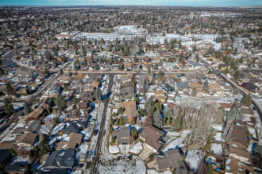 Soaring over Lakeview in Saskatoon, this bird's-eye capture magnifies the neighborhood's tranquil waters, verdant parks, and the serene rhythm of Saskatchewan living