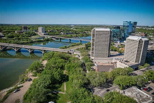 Aerial spectacle of downtown Saskatoon, revealing the city's architectural marvels, bustling streets, and the pulsating core of Saskatchewan's metropolis