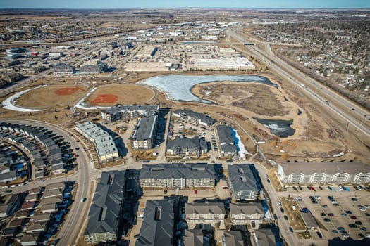 Captivating aerial shot of Stonebridge in Saskatoon, highlighting the harmonious blend of modern architecture and Saskatchewan's verdant surroundings.