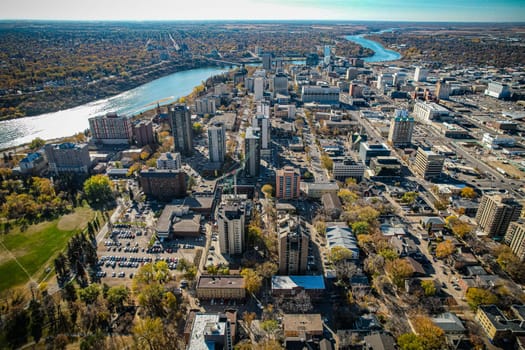 Aerial spectacle of downtown Saskatoon, revealing the city's architectural marvels, bustling streets, and the pulsating core of Saskatchewan's metropolis
