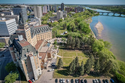 Aerial spectacle of downtown Saskatoon, revealing the city's architectural marvels, bustling streets, and the pulsating core of Saskatchewan's metropolis