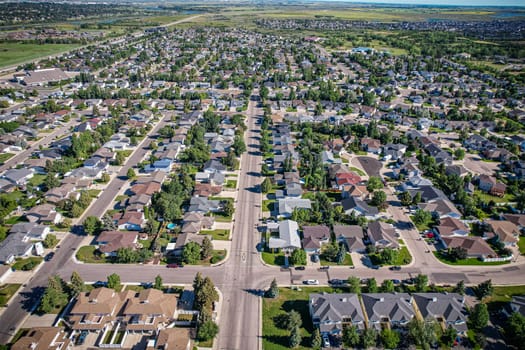 Aerial journey over Silverspring in Saskatoon, revealing a harmonious blend of suburban life, green expanses, and the distinct charm of Saskatchewan's landscapes.