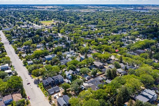 Explore the quaint Haultain neighborhood in Saskatoon from above. This drone image captures its charming streets, cozy homes, and the vibrant community spirit, all under the expansive prairie sky.