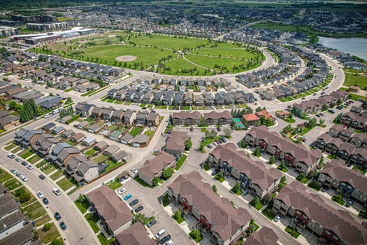 Captivating aerial shot of Stonebridge in Saskatoon, highlighting the harmonious blend of modern architecture and Saskatchewan's verdant surroundings.