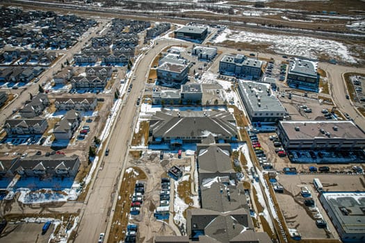 Captivating aerial shot of Stonebridge in Saskatoon, highlighting the harmonious blend of modern architecture and Saskatchewan's verdant surroundings.