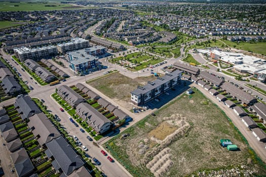 Elevated panorama of Willowgrove, showcasing the neighborhood's modern aesthetics intertwined with pockets of lush green, epitomizing Saskatoon's suburban beauty