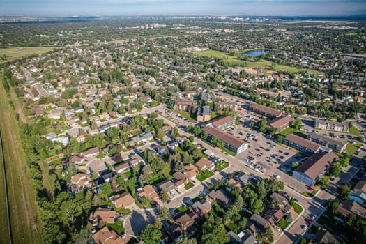 Soaring over Lakeview in Saskatoon, this bird's-eye capture magnifies the neighborhood's tranquil waters, verdant parks, and the serene rhythm of Saskatchewan living