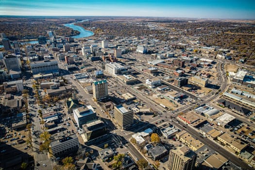 Aerial spectacle of downtown Saskatoon, revealing the city's architectural marvels, bustling streets, and the pulsating core of Saskatchewan's metropolis